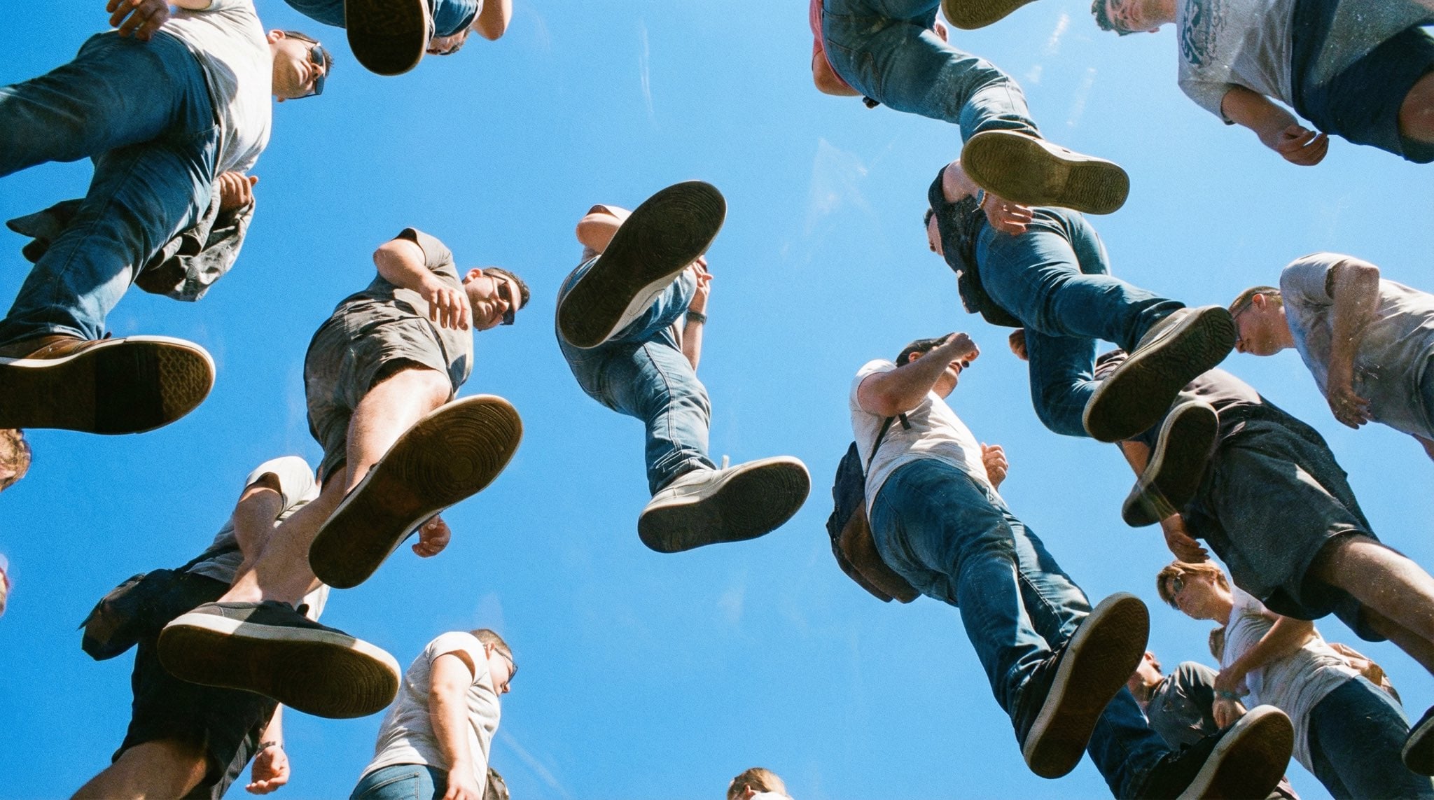 People Walking on Transparent Plexiglass Above — image 2