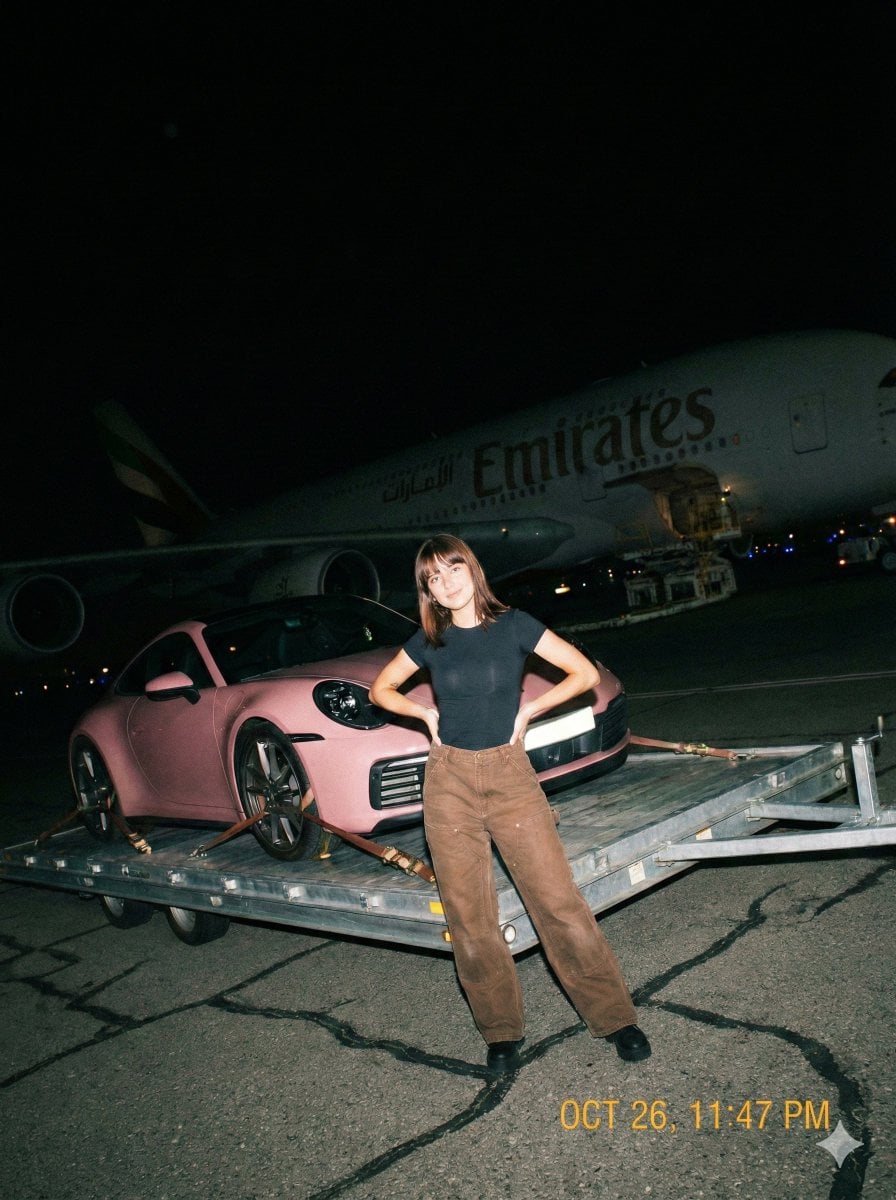 Woman Poses With Pink Porsche Beside Emirates A380