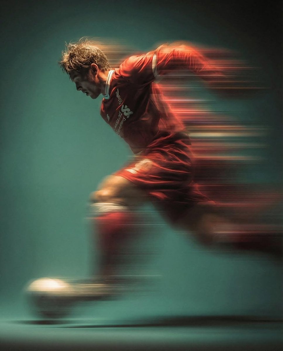Soccer Player Kicking Ball in Mid-Air
