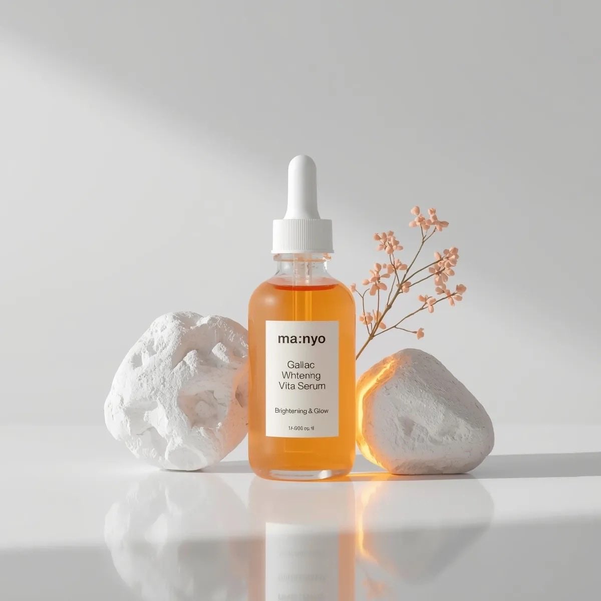 Amber Serum Bottle Surrounded by Stone and Flowers — image 2